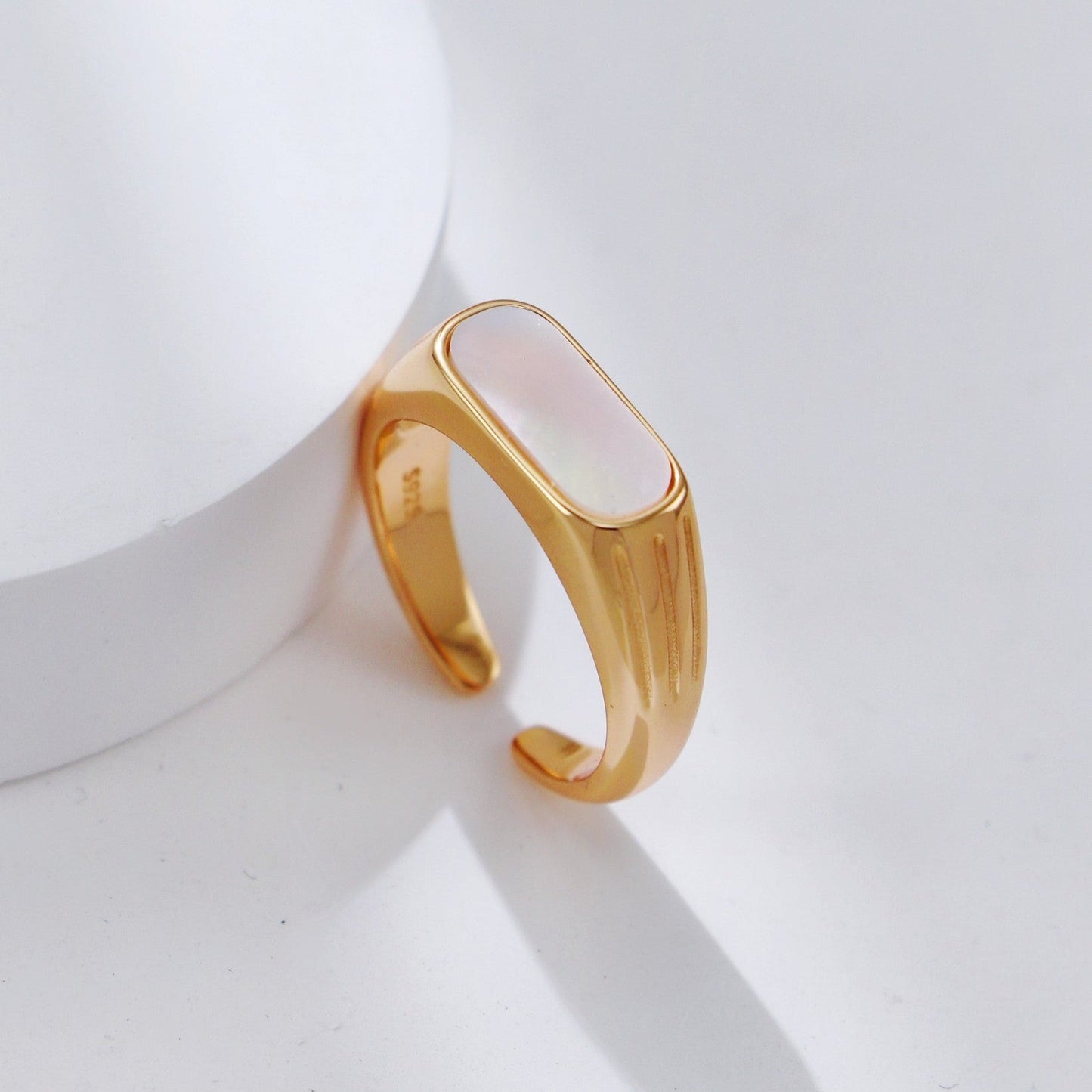 Pearl ring on white background