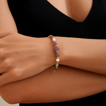 Solara natural pearl, energy crystal, 925 sterling silver bracelet on neutral background