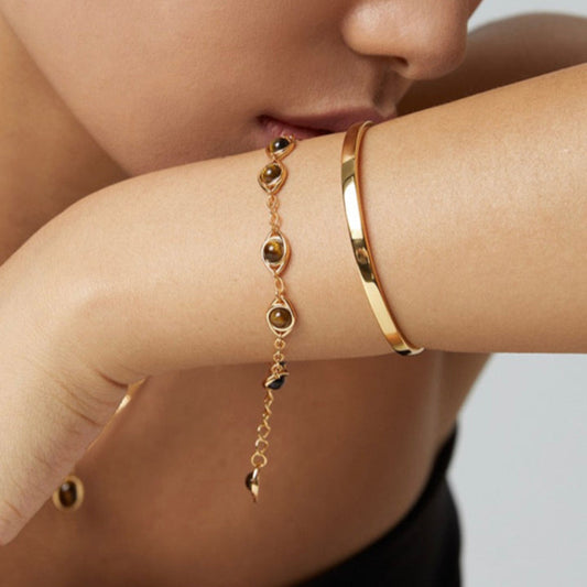 Model wearing tiger’s eye bracelet by Solara