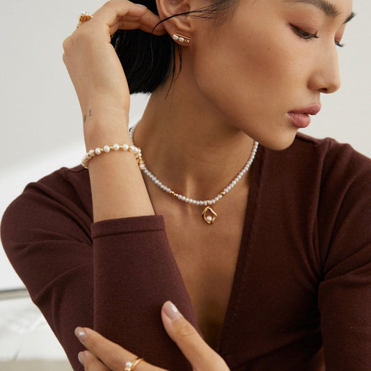 Model wearing pearl necklace by Solara