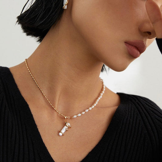 Model wearing pearl necklace by Solara