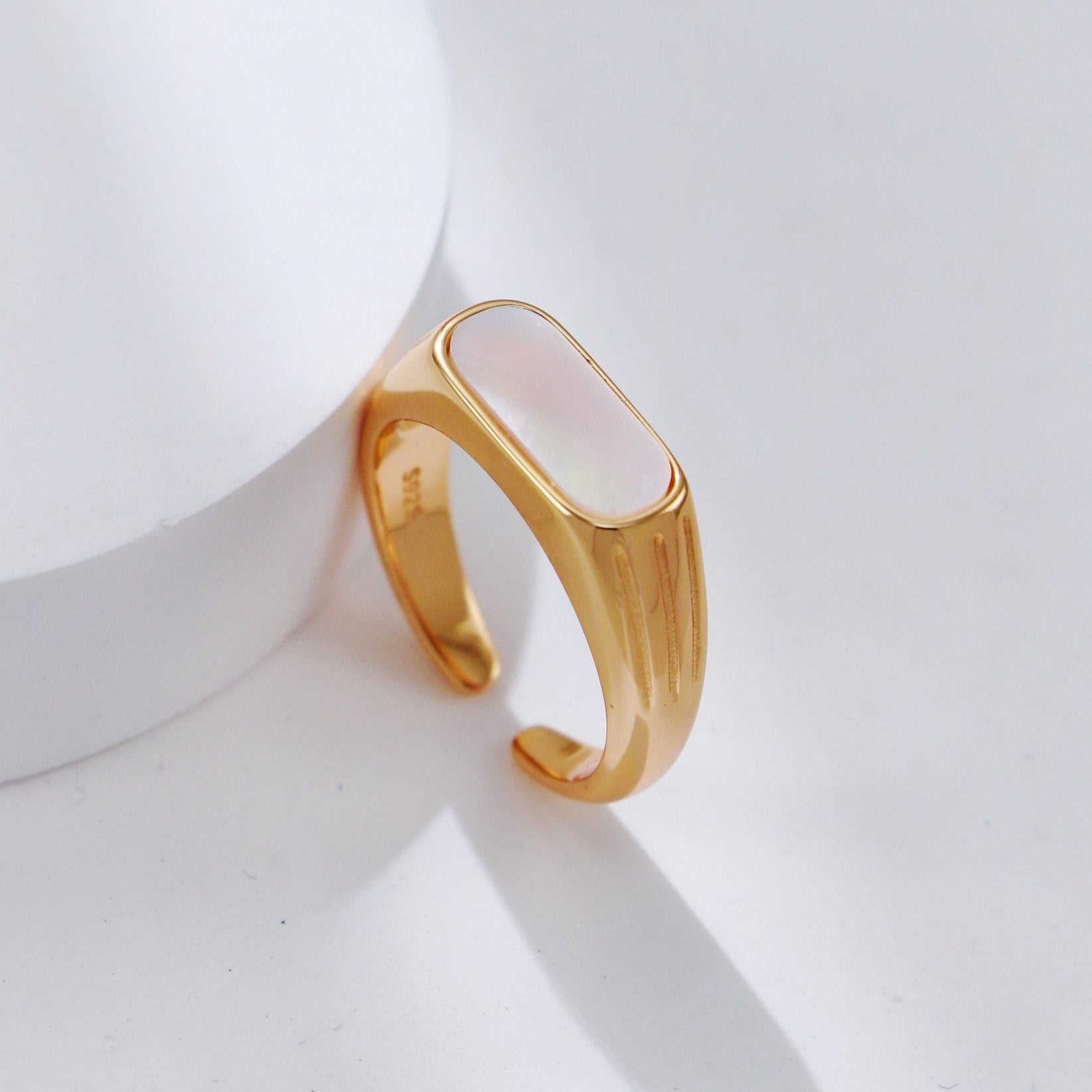 Pearl ring on white background